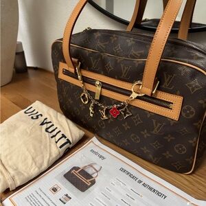 Louis Vuitton Monogram Bag with Gold and Red Accents
